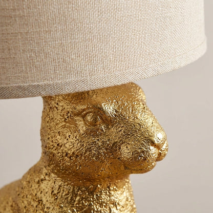 Tafellampe Hase in Gold mit Leinenschirm