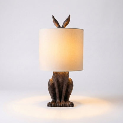 Tafellampe Hase in Gold mit Leinenschirm