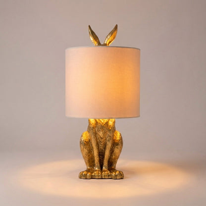 Tafellampe Hase in Gold mit Leinenschirm
